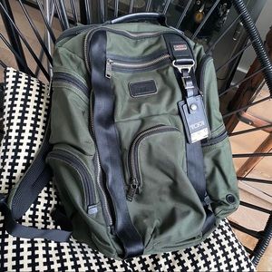 Green Tumi backpack